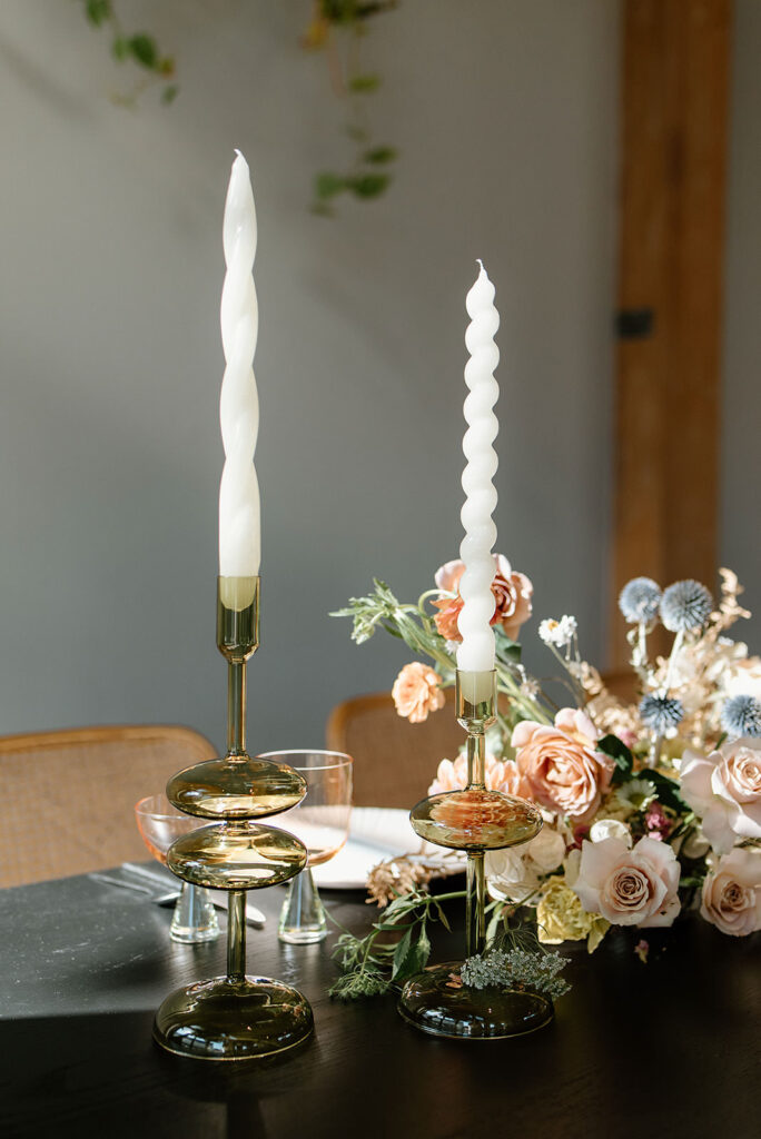 Wedding table decor filled with flowers and candles