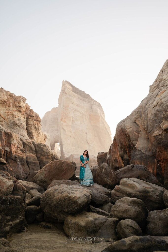 Girl dressed in a traditional sari while standing on a cliff in Oregon